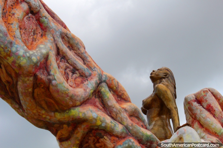 The golden mermaid looks to the sky, monument near the river in Pucallpa. (720x480px). Peru, South America.
