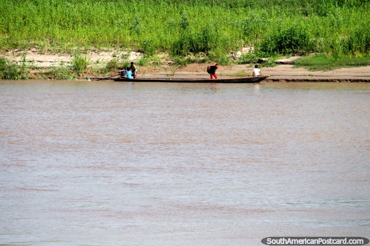 4 children in a river canoe on the edge of the smaller Huallaga River south of Lagunas. (720x480px). Peru, South America.
