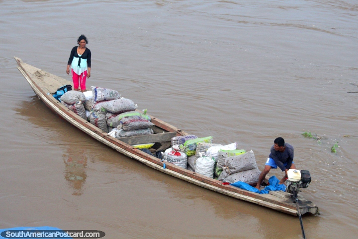 A river boat full with produce either arriving at or leaving Maipuco on the Maranon River in the Amazon. (720x480px). Peru, South America.