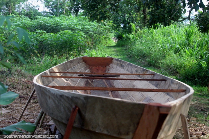 Wooden boat sitting in the middle of the pathway near the Amazon River around Iquitos. (720x480px). Peru, South America.
