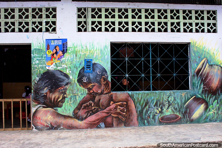 Mural of a man painting a boy in Belen, a neighborhood in Iquitos. (720x480px). Peru, South America.