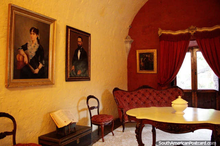 Family room / lounge with paintings of the family, beautiful couch with matching curtains and wall, mansion of the founder of Arequipa. (720x480px). Peru, South America.