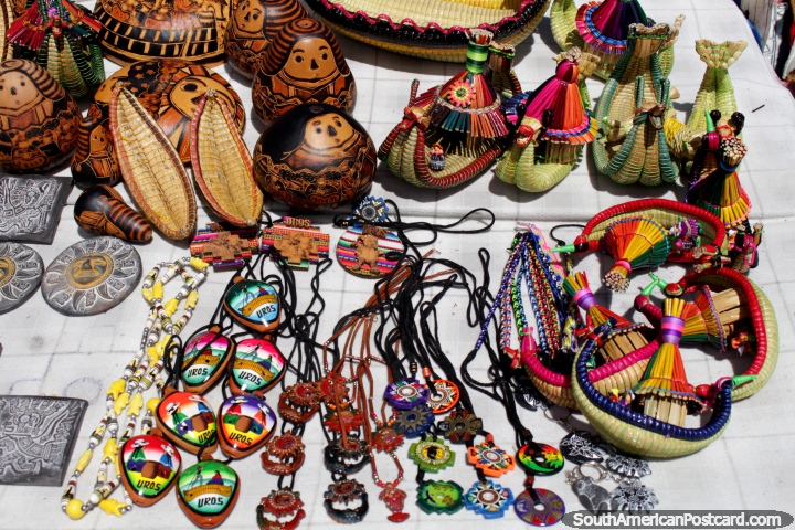 Arts, crafts and souvenirs to buy when you visit a floating reed island at Lake Titicaca, Puno. (720x480px). Peru, South America.