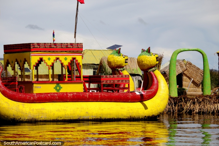 Yellow and red dragon boat glows in the sun as we arrive at another floating island in Puno. (720x480px). Peru, South America.