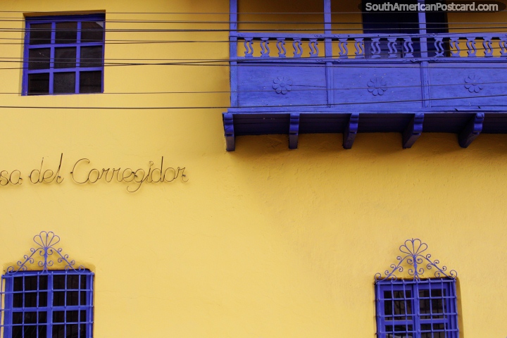 Blue balcony and windows, the yellow facade of Corregidor Cafe and Bar in Puno. (720x480px). Peru, South America.