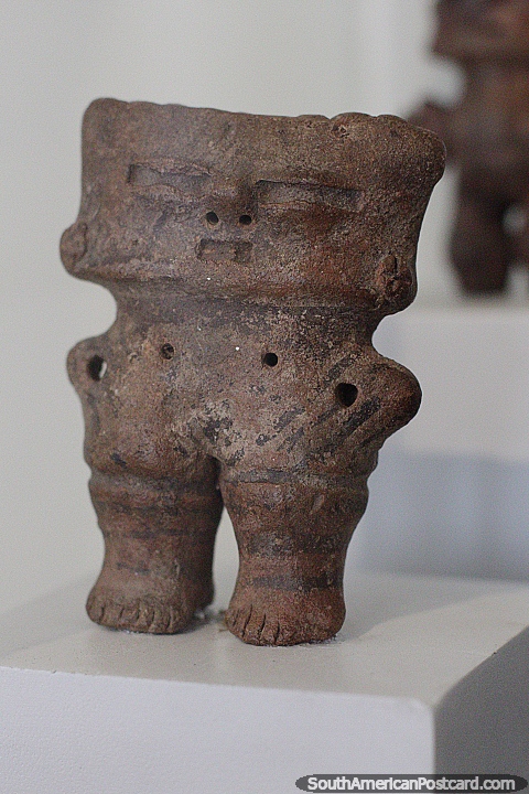 Carlos Dreyer Museum in Puno has a lot of interesting and ancient arts to see, a small granite figure. (480x720px). Peru, South America.