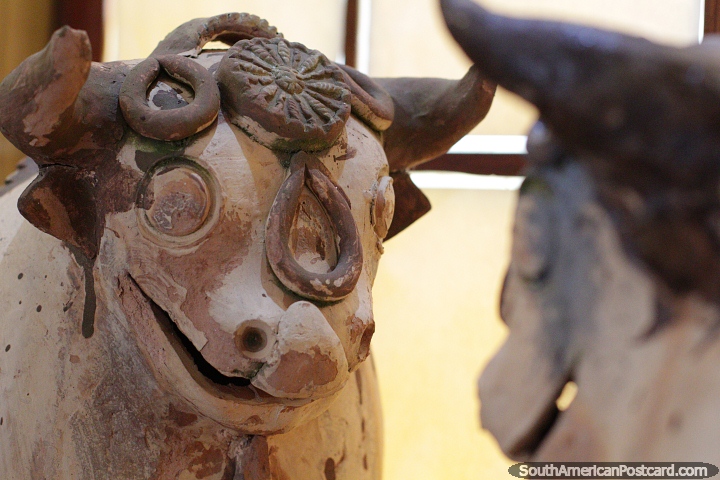 Ceramic cows, a pair, works discovered and on display at the Carlos Dreyer Museum, Puno. (720x480px). Peru, South America.