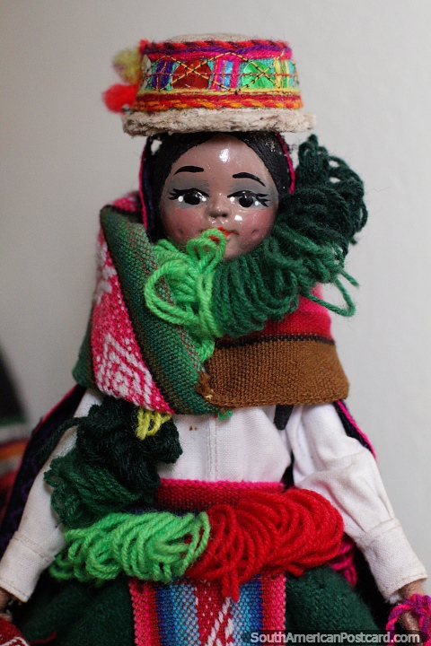 Huifala - Wifala, dance of the flags, doll in fine traditional outfit at the Carlos Dreyer Museum, Puno. (480x720px). Peru, South America.