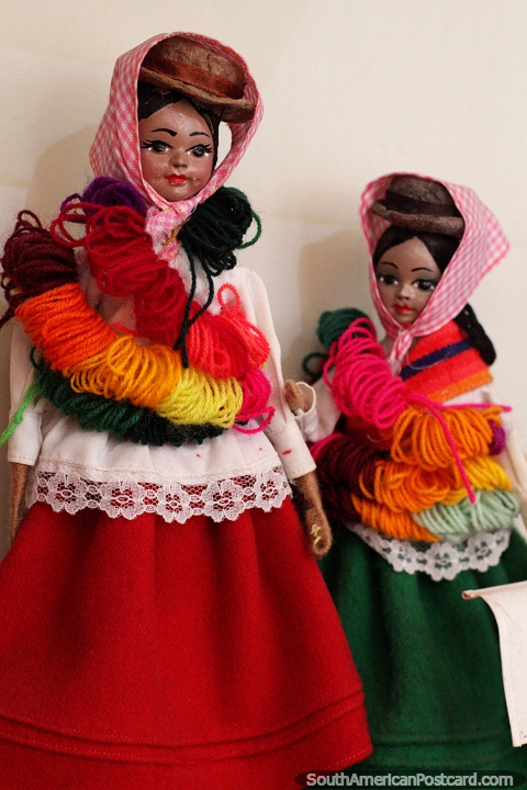 Huifala - Wifala women dressed in colorful wool with hats and scarves, figures on display at the Carlos Dreyer Museum, Puno. (480x720px). Peru, South America.