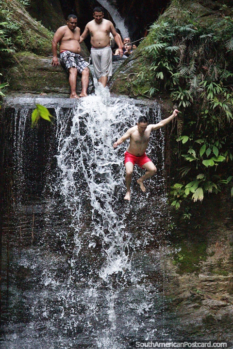 Carpishuyacu Waterfall in the jungle, man jumps down, Tarapoto. (480x720px). Peru, South America.