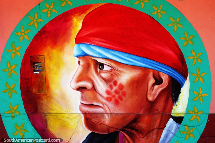 Face paint of red spots, man with red and blue headpiece, mural in Lamas. (720x480px). Peru, South America.
