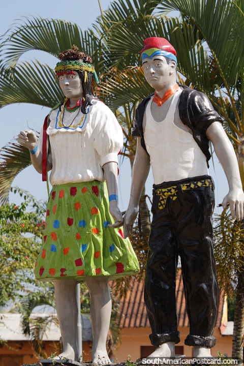 Man and woman in traditional clothing, monument at Wayku plaza in Lamas. (480x720px). Peru, South America.