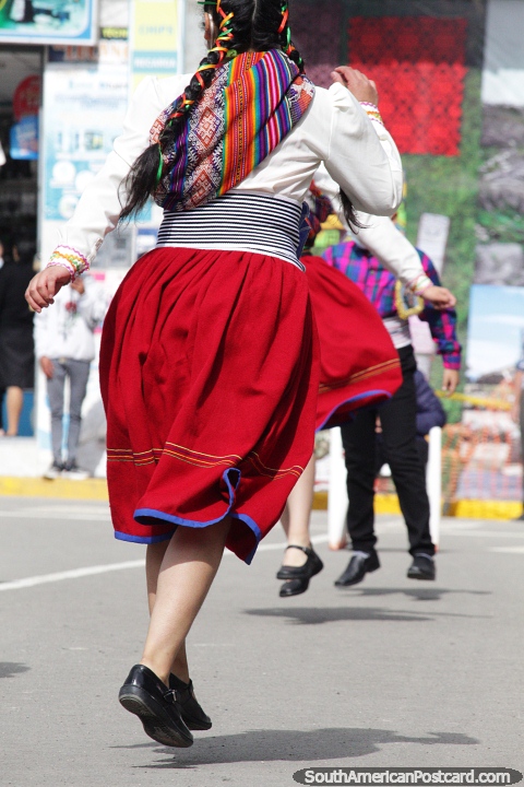 Dancing and a street performance by locals in Chota begins. (480x720px). Peru, South America.