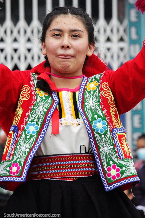 Woman in red with an intricately designed traditional jacket performs in Chota. (480x720px). Peru, South America.