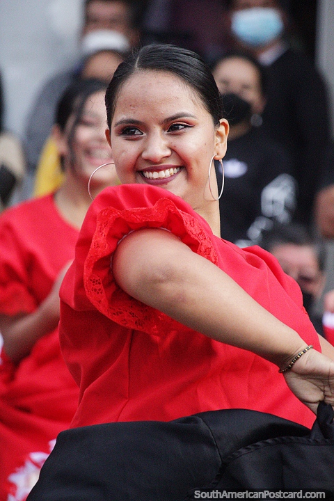 Woman with a big smile enjoys the street show and celebration in Chota. (480x720px). Peru, South America.