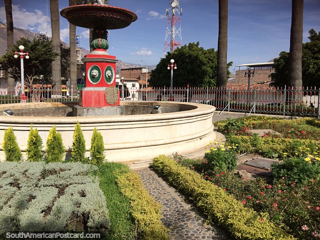 Fountain and gardens at the central plaza in Caraz. (640x480px). Peru, South America.