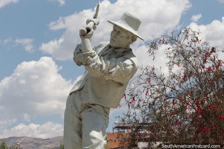 Man in hat swings a pick, cultural statue at the park in Huaraz. (720x480px). Peru, South America.