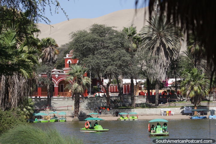 Picturesque scene with the lagoon, church and archways behind in Huacachina. (720x480px). Peru, South America.