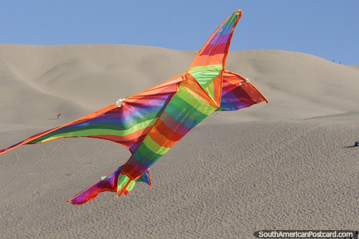Kite flying is another great activity to enjoy at the sand dunes in Huacachina. (720x480px). Peru, South America.