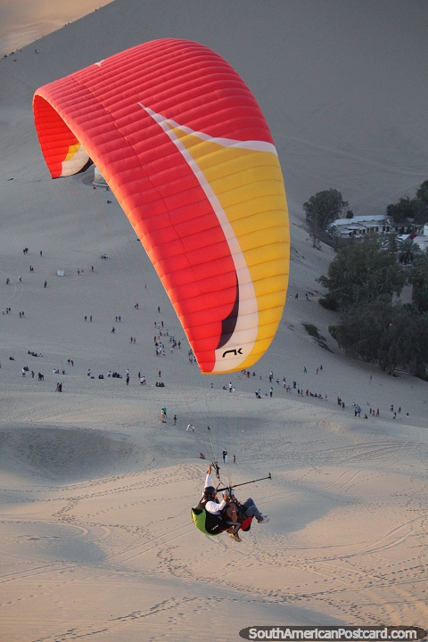Paragliding is another adventure sport option in Huacachina. (480x720px). Peru, South America.