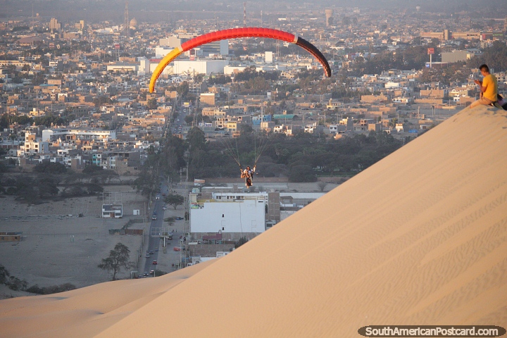 Wow, paragliding in Huacachina with the city of Ica behind. (720x480px). Peru, South America.