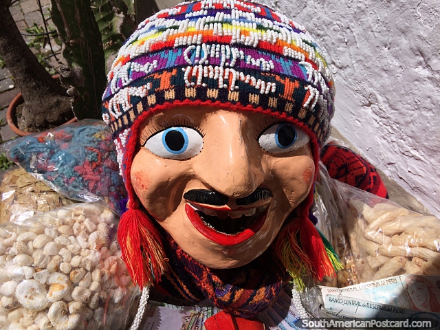 Friendly welcome to a shop with a large smiling doll outside, Cusco. (640x480px). Peru, South America.