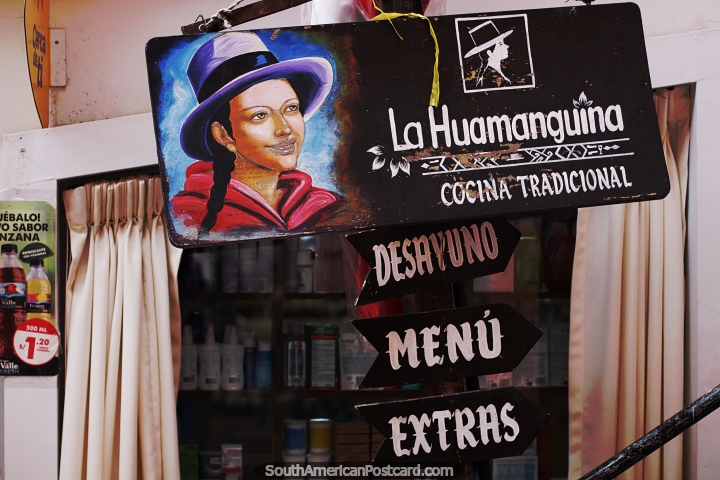 Indigenous woman with hat, wooden sign of a restaurant in Ayacucho. (720x480px). Peru, South America.