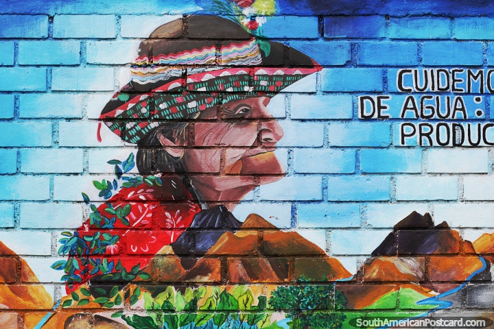 Elder indigenous woman with hat in nature, water care, mural in Ayacucho. (720x480px). Peru, South America.
