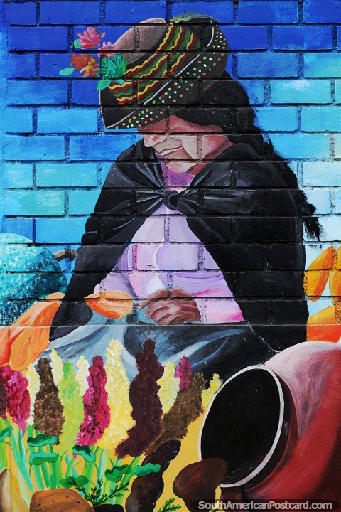 Lady with flowers and a large urn, colorful mural in Ayacucho. (480x720px). Peru, South America.