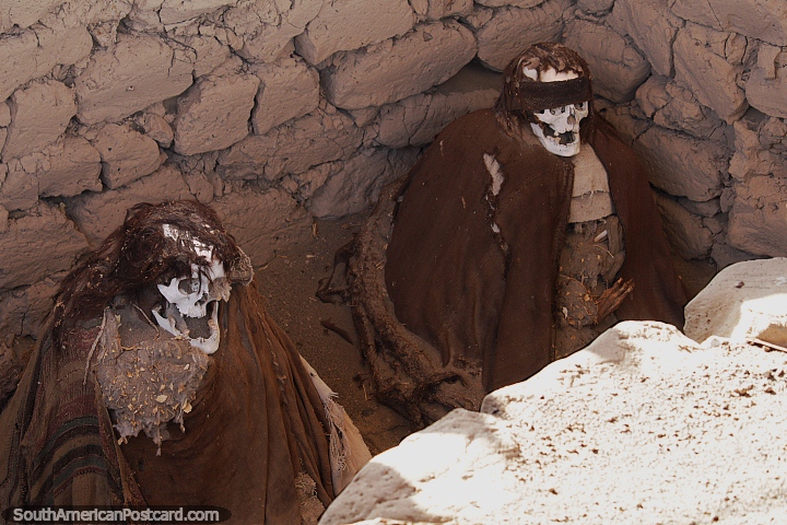 Burial pit with 2 skeletons dressed in brown robes at Chauchilla cemetery in Nazca. (720x480px). Peru, South America.