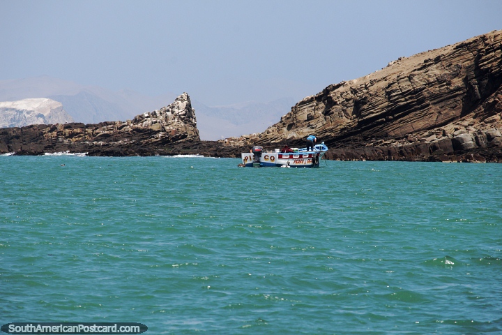 Turquoise ocean around the rocky cliffs at Paracas National Park. (720x480px). Peru, South America.