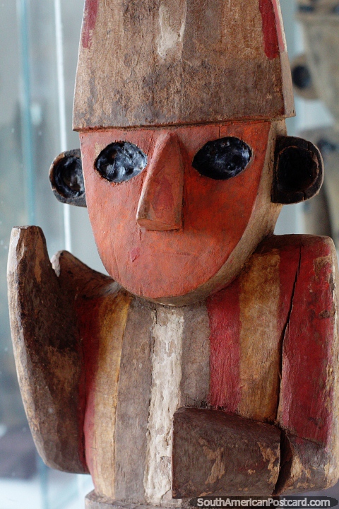 Chimu man, ancient wooden figure with a rainbow colored shirt, Chan Chan museum, Trujillo. (480x720px). Peru, South America.
