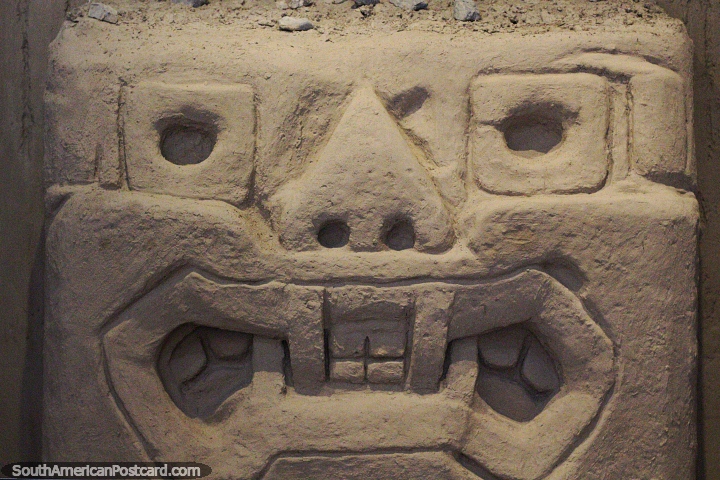 Ancient face carved from stone, the Chimu civilization at the Chan Chan museum, Trujillo. (720x480px). Peru, South America.
