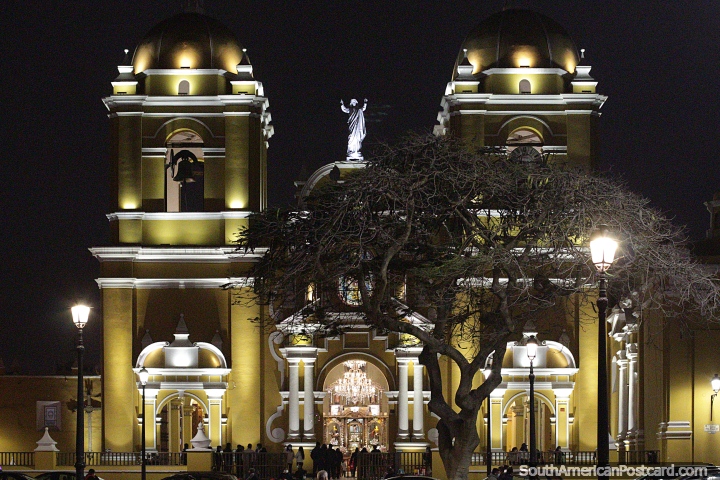 Yellow cathedral glows under lights at night in Trujillo. (720x480px). Peru, South America.