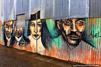 A mural of 4 figures on corrugated iron in Cayenne, French Guiana. 