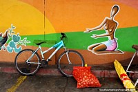A painting, a bicycle and a sack of onions, days end at the Cayenne markets in French Guiana. The 3 Guianas, South America.
