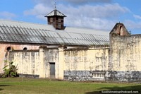 The stone walls inside Le Camp de la Transportation, prison in Saint Laurent du Maroni, French Guiana. The 3 Guianas, South America.