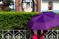 Sugar planter William Russell (1827-1888) bust, woman with a purple umbrella, Georgetown, Guyana. The 3 Guianas, South America.