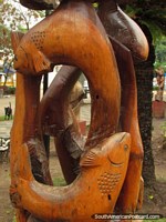 Wooden sculpture of fish at Plaza San Martin in Colon. Argentina, South America.