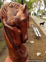 Horse wooden sculpture at Plaza San Martin in Colon. Argentina, South America.