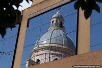 The dome of the Salta Cathedral, reflection in the windows of a nearby building. Argentina, South America.