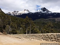 A beautiful landscape during the drive along Route 65 to Traful with snow-capped mountains and forest. Argentina, South America.