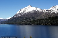 The road travels directly beside these beautiful lakes and mountains south of Bariloche. Argentina, South America.