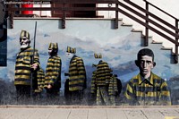Larger version of Mural of prisoners dressed in yellow and black in central Ushuaia.