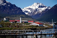 The Naval Base in Ushuaia with huge snow-capped mountains behind. Argentina, South America.