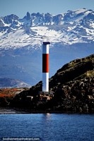 One of the red and white lighthouses seen on the Bird Island Tour in Ushuaia. Argentina, South America.