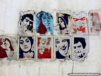 10 faces on pieces of paper stuck on a wall in Ushuaia, this makes great art! Argentina, South America.