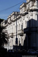 Grey stone balconies and arches of the government palace in Parana, side view. Argentina, South America.