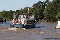 Large tour boat takes people on a journey around the delta in Tigre, Buenos Aires. Argentina, South America.