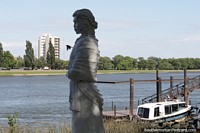 White statue of a woman in Patagones, view to the river across to Viedma. Argentina, South America.